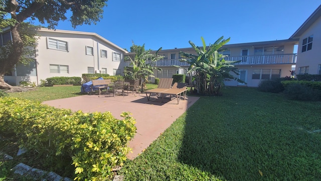 surrounding community featuring a yard and a patio