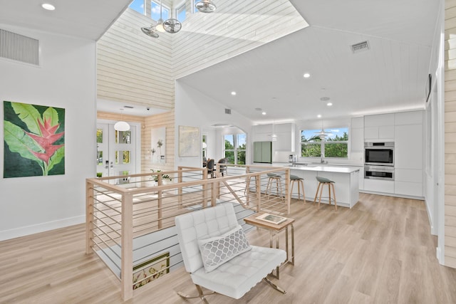 interior space featuring french doors and light hardwood / wood-style floors