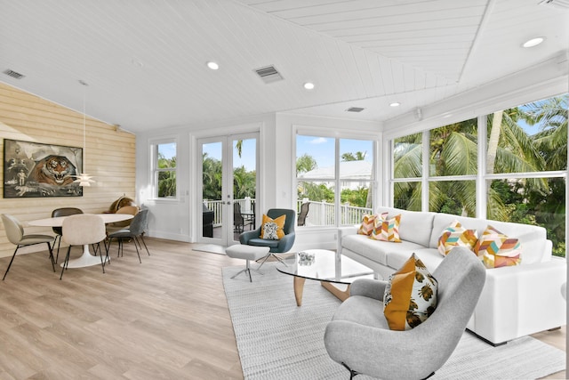 sunroom featuring wood ceiling, lofted ceiling, and french doors