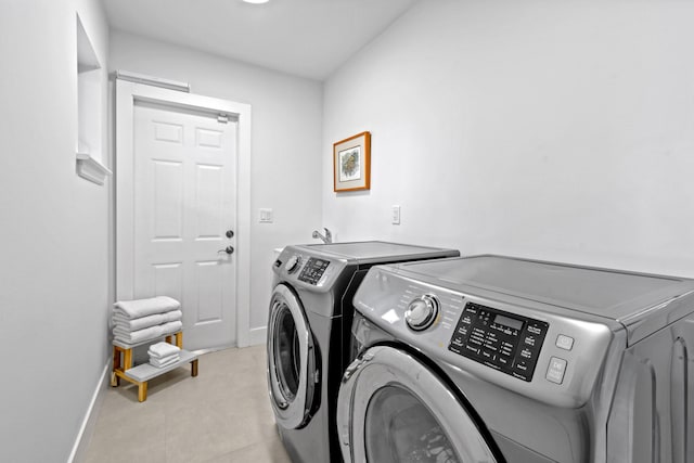 clothes washing area with washer and dryer