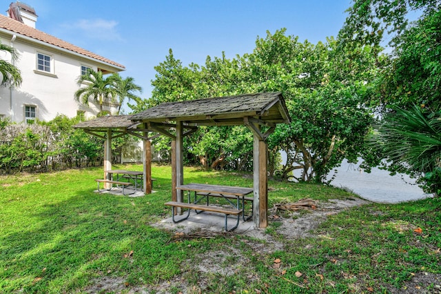 view of home's community with a lawn