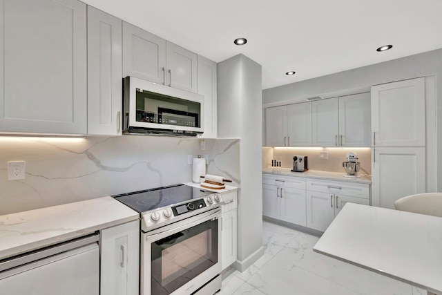 kitchen featuring stainless steel range with electric stovetop, backsplash, light stone countertops, dishwashing machine, and white cabinetry