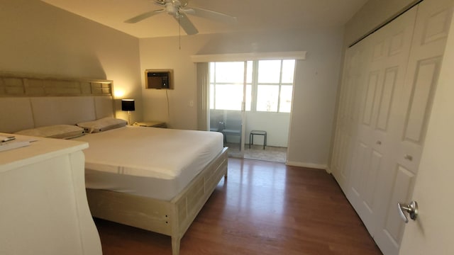 bedroom with ceiling fan, dark hardwood / wood-style floors, and a closet