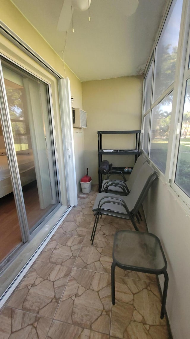 sunroom / solarium with ceiling fan