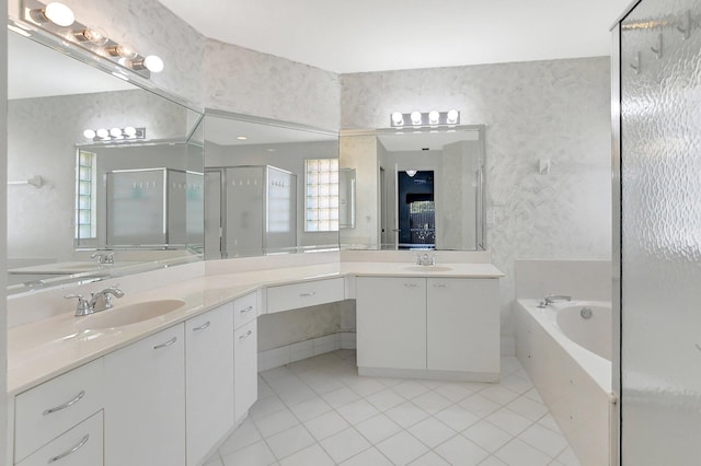 bathroom featuring tile patterned flooring, vanity, and separate shower and tub