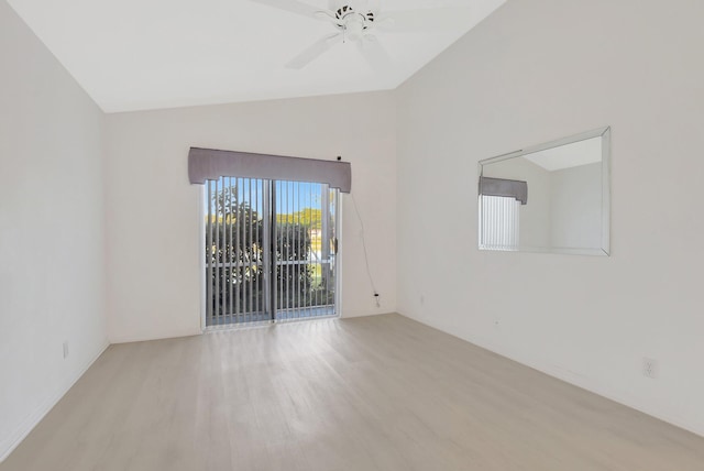 spare room with light hardwood / wood-style flooring, ceiling fan, and lofted ceiling