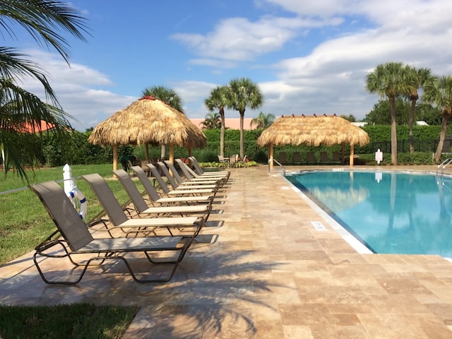 view of swimming pool featuring a gazebo and a patio area