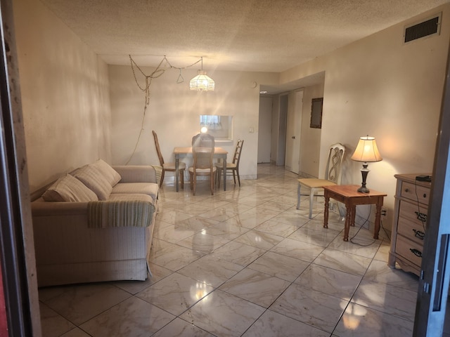 living room featuring a textured ceiling