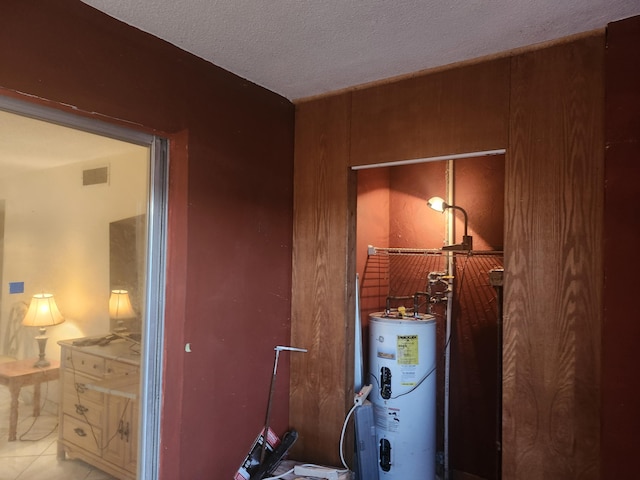 utility room featuring electric water heater