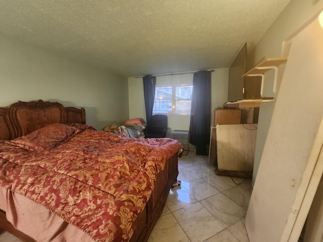 bedroom featuring a textured ceiling