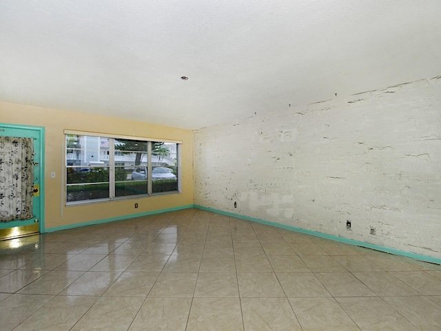 empty room featuring light tile patterned floors