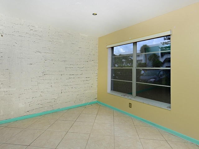 unfurnished room featuring tile patterned floors