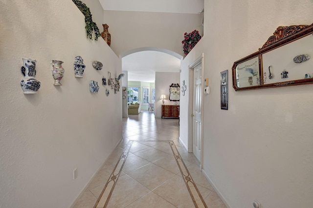 hallway with light tile patterned floors