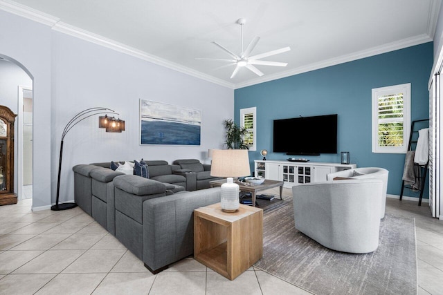 tiled living room featuring ceiling fan with notable chandelier and ornamental molding