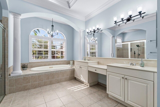 bathroom with an inviting chandelier, tile patterned floors, ornamental molding, independent shower and bath, and decorative columns