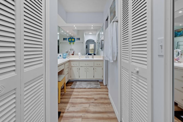 bathroom featuring vanity and hardwood / wood-style flooring