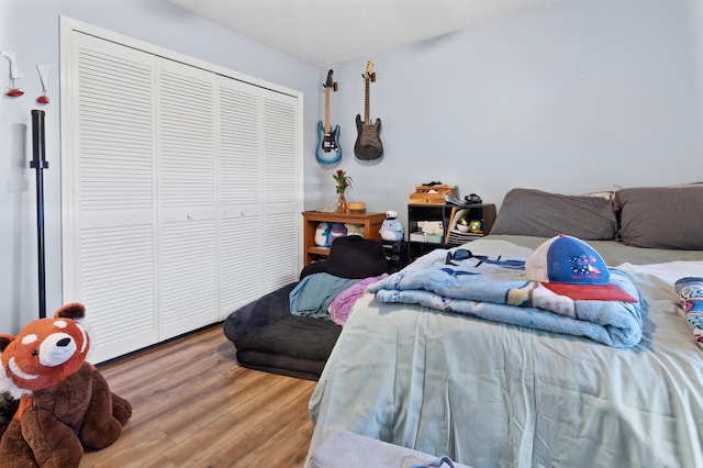 bedroom with hardwood / wood-style flooring and a closet