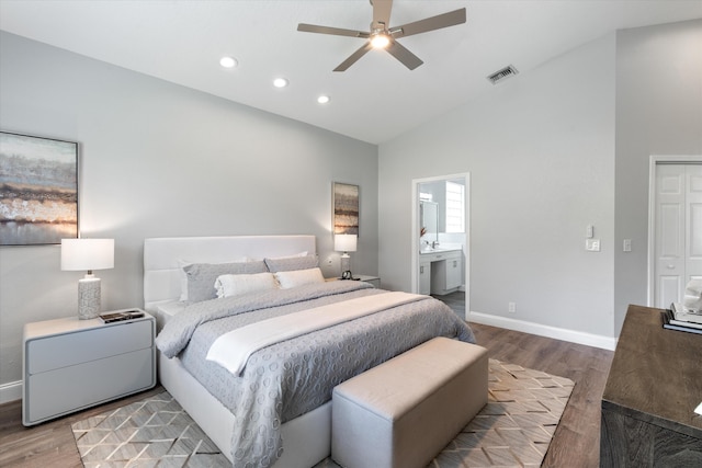 bedroom with ceiling fan, hardwood / wood-style floors, high vaulted ceiling, and ensuite bathroom