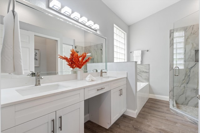 bathroom with vanity, hardwood / wood-style flooring, and separate shower and tub