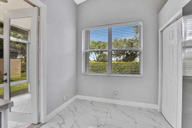 interior space featuring a healthy amount of sunlight and french doors