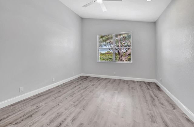 unfurnished room featuring ceiling fan and light hardwood / wood-style flooring