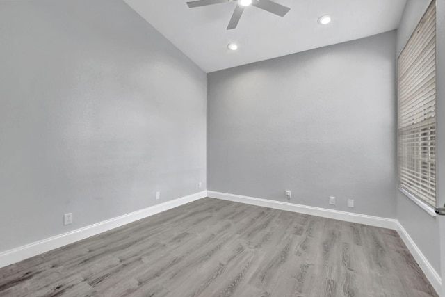 empty room featuring ceiling fan and light hardwood / wood-style floors