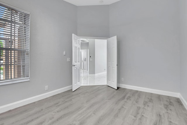 unfurnished bedroom featuring light wood-type flooring