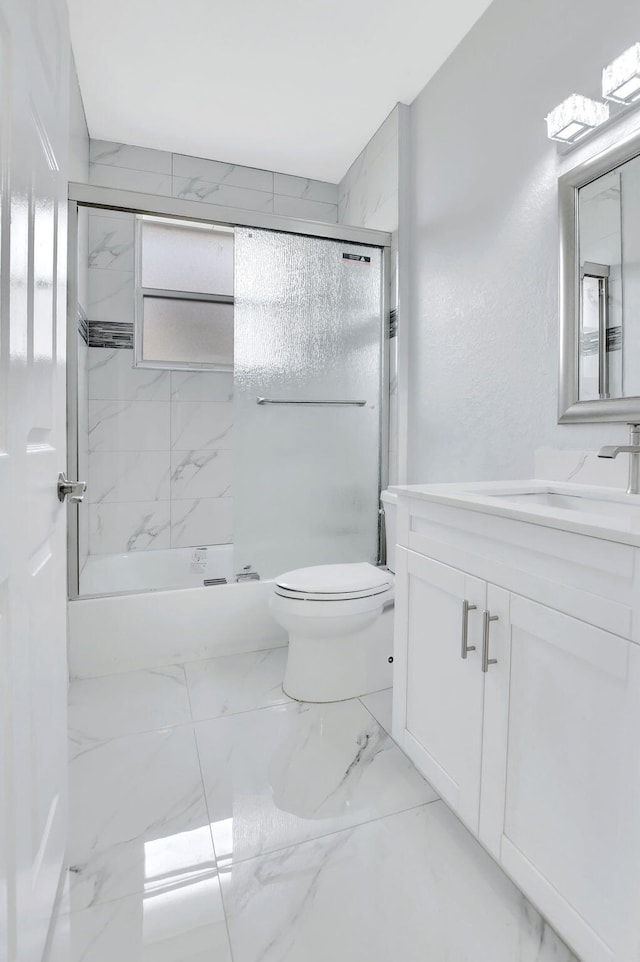 full bathroom with vanity, toilet, and enclosed tub / shower combo