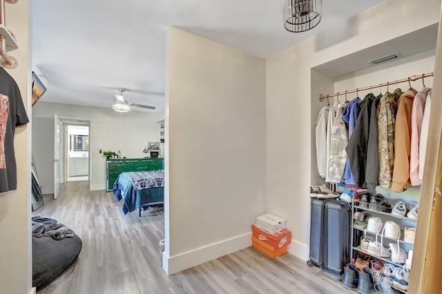 interior space featuring ceiling fan and light wood-type flooring