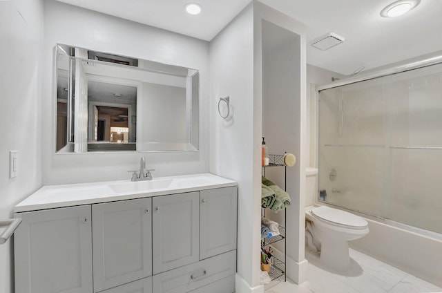 full bathroom featuring shower / bath combination with glass door, vanity, and toilet