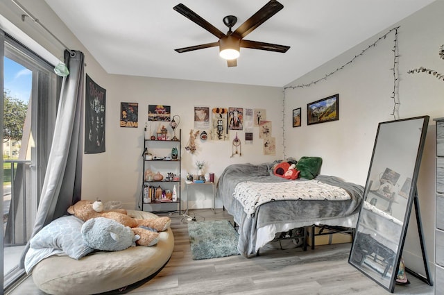 bedroom featuring ceiling fan and light hardwood / wood-style floors