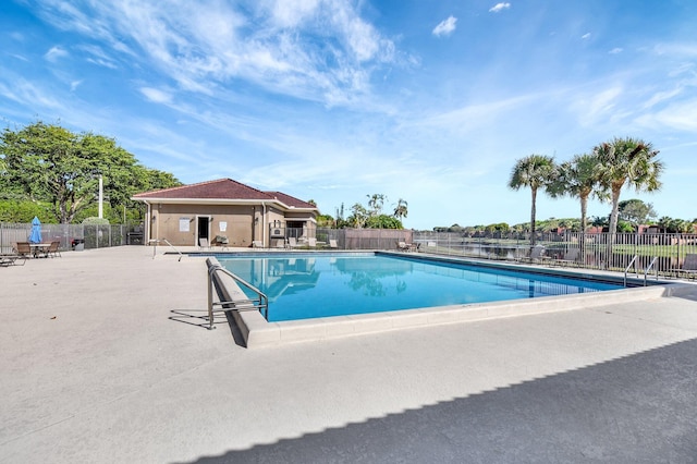 view of swimming pool featuring a patio area