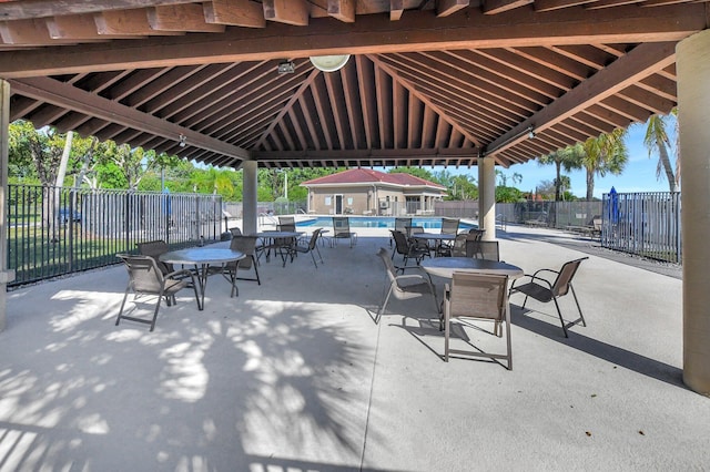 view of patio featuring a gazebo and a community pool