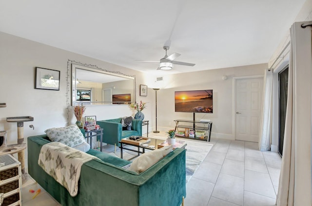 living room with ceiling fan and light tile patterned flooring