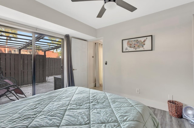 bedroom featuring access to outside, ceiling fan, and light hardwood / wood-style floors