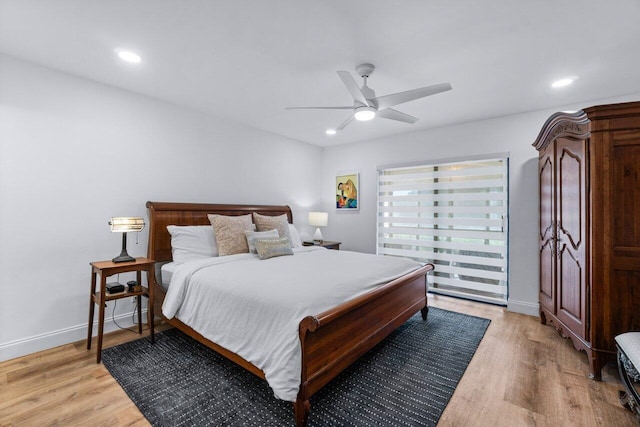 bedroom featuring light hardwood / wood-style floors and ceiling fan