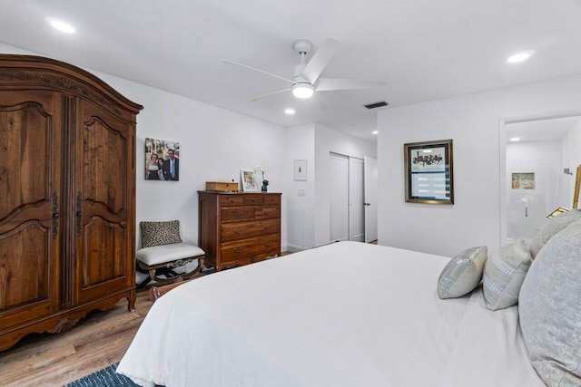 bedroom with ceiling fan, a closet, and light wood-type flooring