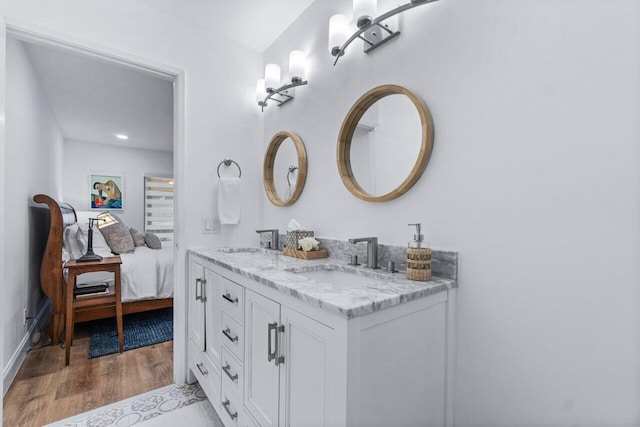 bathroom featuring vanity and wood-type flooring