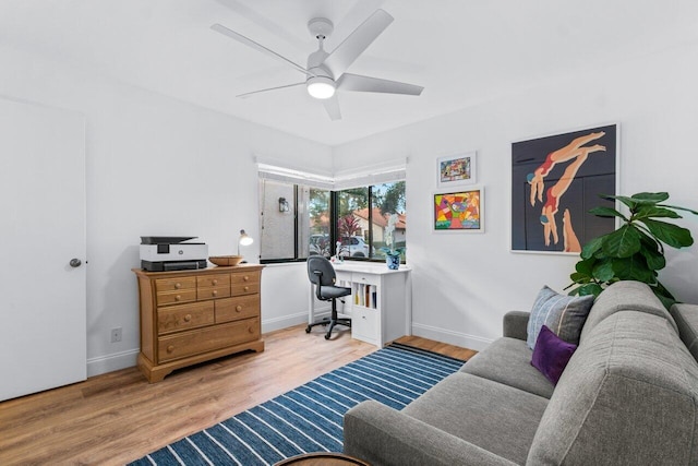 office space featuring ceiling fan and light wood-type flooring