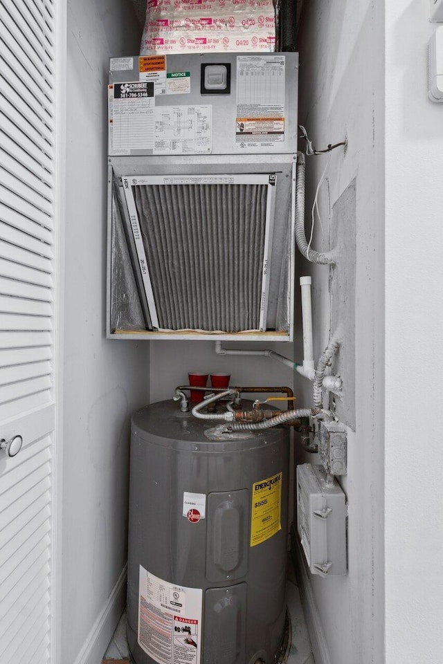 utility room featuring water heater