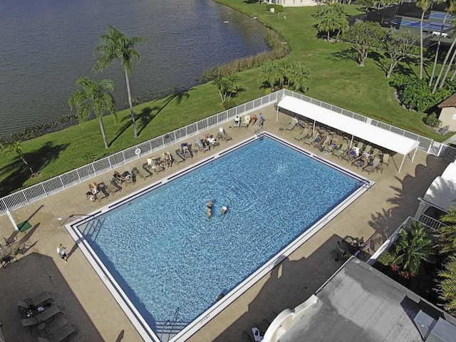 view of swimming pool with a water view