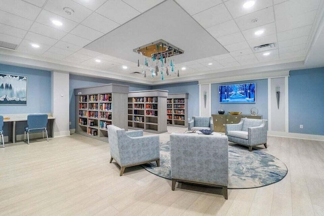 interior space featuring hardwood / wood-style floors and a paneled ceiling