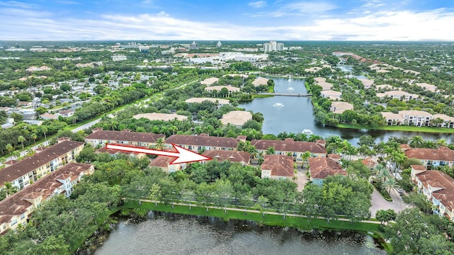 birds eye view of property featuring a water view