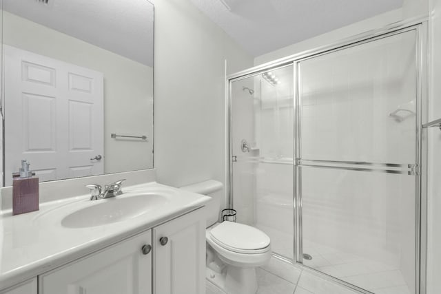 bathroom with tile patterned floors, a textured ceiling, toilet, vanity, and a shower with shower door