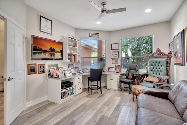 office space with ceiling fan and light hardwood / wood-style flooring