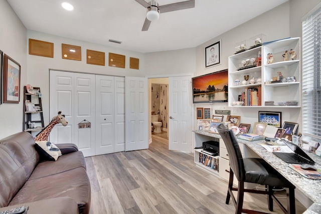 office space with ceiling fan and light hardwood / wood-style flooring