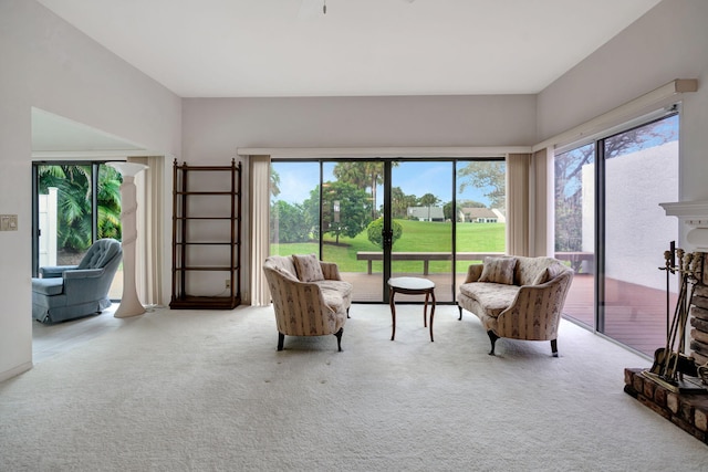 carpeted living room featuring plenty of natural light