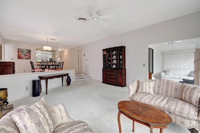 living room with ceiling fan and light colored carpet