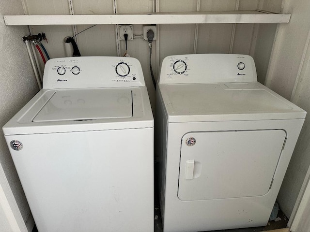 clothes washing area with washing machine and clothes dryer