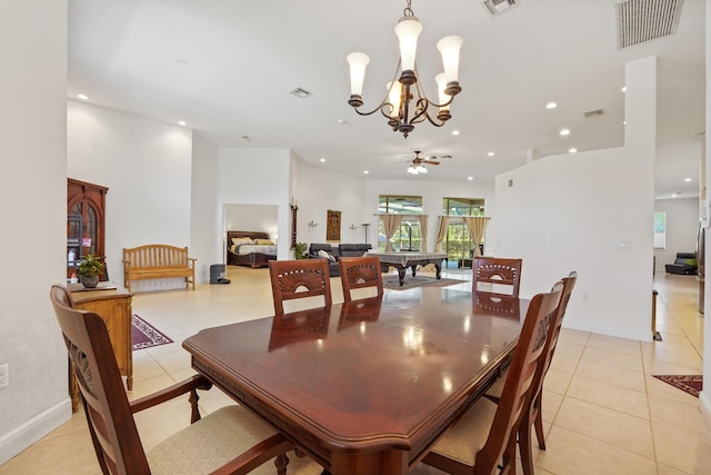 tiled dining space with ceiling fan with notable chandelier and pool table